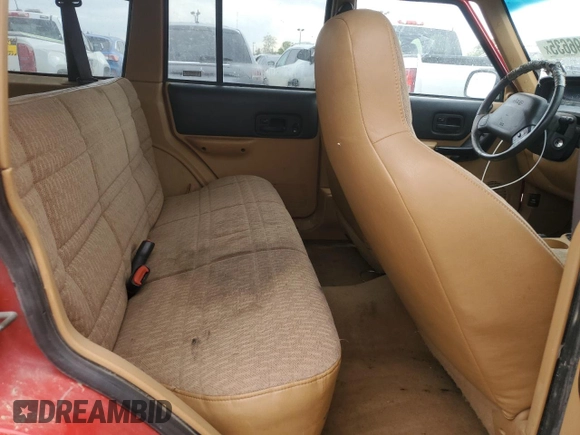 1998 Jeep Cherokee Sport z VIN 1J4FJ68S6WL279262, wystawiony jako Copart lot #56496635 z przebiegiem 160 176 mil mil oraz Czysty tytuł • Clean title. Historia ofert i sprzedaży dostępna na DreamBid. Obrazek 11.