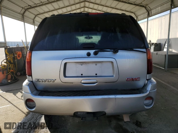 2005 GMC Envoy SLE with VIN 1GKDS13S852374516, listed as a Copart auction lot 42409725 with 299,816 mi miles and Salvage Title. Bid and sale history available at carsss.com. Image 6.