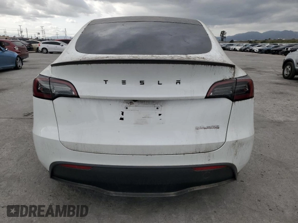 2023 Tesla Model Y Performance z VIN 7SAYGDEFXPF801908, wystawiony jako Copart lot #50737655 z przebiegiem Nie podano mil oraz Szkoda całkowita • Salvage title. Historia ofert i sprzedaży dostępna na DreamBid. Obrazek 6.