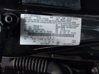 2014 Ford Focus Titanium with VIN 1FADP3J24EL439065, listed as a IAAI auction lot 40868973 with 167,739 mi miles. Bid and sale history available at carsss.com. Image 9.