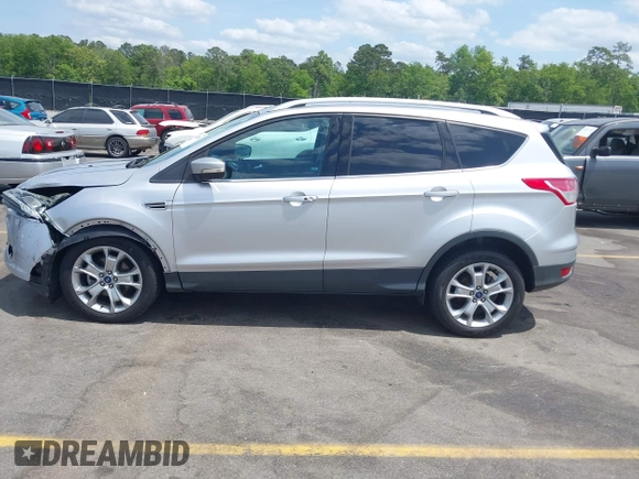 2014 Ford Escape Titanium with VIN 1FMCU0JX7EUA28824, listed as a IAAI auction lot 42065325 with 107,761 mi miles. Bid and sale history available at carsss.com. Image 14.