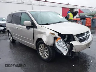 2014 Dodge Grand Caravan SXT with VIN 2C4RDGCG7ER427198, listed as a IAAI auction lot 41092605 with 153,365 mi miles and . Bid and sale history available at DreamBid. Image 1.