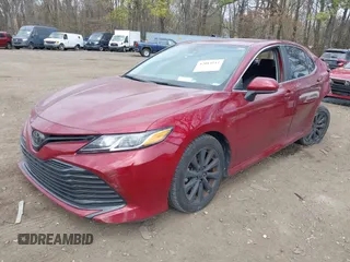 2020 Toyota Camry LE with VIN 4T1C11AK4LU920044, listed as a IAAI auction lot 42084112 with 96,745 mi miles and . Bid and sale history available at carsss.com. Image 2.