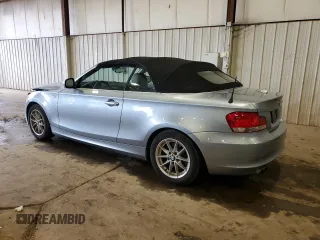 2011 BMW 1 Series 128i with VIN WBAUL7C57BVM80274, listed as a Copart auction lot 52127595 with 104,952 mi miles and Salvage title. Bid and sale history available at DreamBid. Image 2.