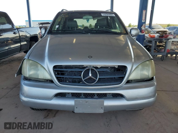 2000 Mercedes-Benz M-Class with VIN 4JGAB54E1YA193102, listed as a Copart auction lot 74294404 with 202,107 mi miles and Salvage Title. Bid and sale history available at carsss.com. Image 5.