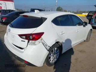 2014 Mazda 3 i Grand Touring with VIN JM1BM1M7XE1102093, listed as a IAAI auction lot 41344433 with 148,395 mi miles and . Bid and sale history available at DreamBid. Image 4.