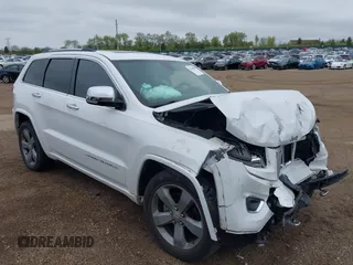 2015 Jeep Grand Cherokee Overland z VIN 1C4RJECG5FC780093, wystawiony jako IAAI lot #42190882 z przebiegiem 103 980 mil mil oraz . Historia ofert i sprzedaży dostępna na DreamBid. Obrazek 1.