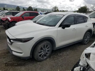 2019 Mazda CX-5 Signature with VIN JM3KFBEYXK0537826, listed as a Copart auction lot 50063015 with 76,448 mi miles and Salvage Title. Bid and sale history available at carsss.com. Image 1.