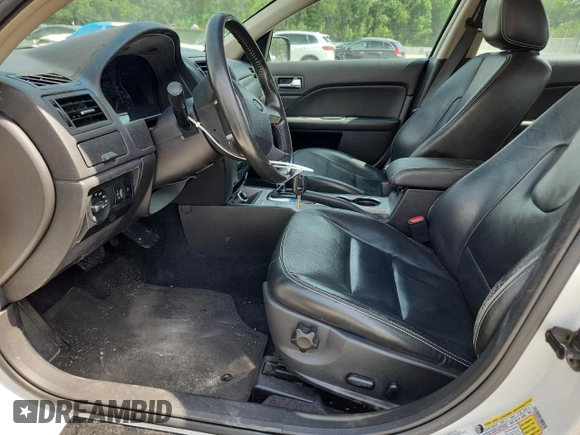 2010 Ford Fusion Hybrid z VIN 3FADP0L39AR152224, wystawiony jako Copart lot #60549615 z przebiegiem 118 939 mil mil oraz Szkoda całkowita • Salvage title. Historia ofert i sprzedaży dostępna na DreamBid. Obrazek 7.