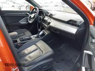 2021 Audi Q3 Premium with VIN WA1AUCF30M1137042, listed as a IAAI auction lot 41502456 with 61,742 mi miles and . Bid and sale history available at DreamBid. Image 5.