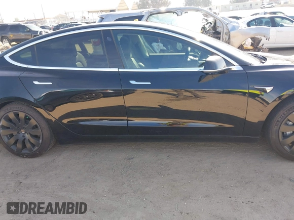 2018 Tesla Model 3 Long Range Battery with VIN 5YJ3E1EA0JF056979, listed as a IAAI auction lot 41865849 with 97,319 mi miles. Bid and sale history available at carsss.com. Image 13.