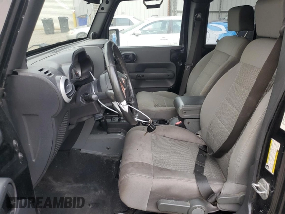 2008 Jeep Wrangler Unlimited Sahara with VIN 1J4GA59148L574934, listed as a Copart auction lot 74590164 with 134,674 mi miles and Salvage title. Bid and sale history available at DreamBid. Image 7.