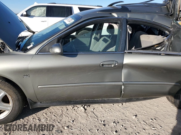 2002 Ford Taurus z VIN 1FAHP59S82A188995, wystawiony jako Copart lot #82141704 z przebiegiem 89 153 mil mil oraz Szkody całkowita. Historia ofert i sprzedaży dostępna na DreamBid. Obrazek 7.