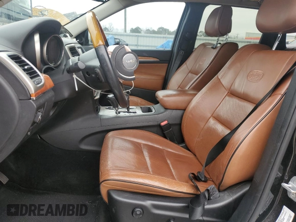 2013 Jeep Grand Cherokee Overland with VIN 1C4RJECG1DC546398, listed as a Copart auction lot 45834595 with 214,975 mi miles and Salvage Title. Bid and sale history available at carsss.com. Image 7.