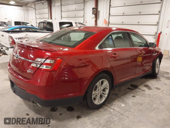 2014 Ford Taurus SEL z VIN 1FAHP2E83EG137639, wystawiony jako IAAI lot #41535259 z przebiegiem 62 978 mil mil oraz . Historia ofert i sprzedaży dostępna na DreamBid. Obrazek 4.
