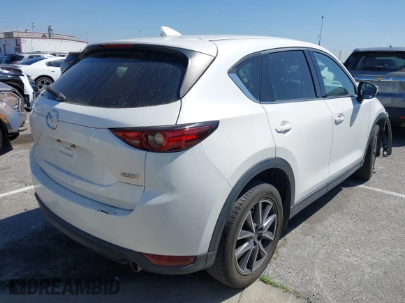 2018 Mazda CX-5 Grand Touring with VIN JM3KFADM8J0373368, listed as a IAAI auction lot 42013535 with 63,142 mi miles and . Bid and sale history available at DreamBid. Image 4.