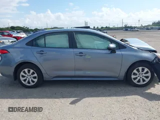 2023 Toyota Corolla Hybrid LE with VIN JTDBCMFE8PJ010693, listed as a IAAI auction lot 41736641 with 10,751 mi miles. Bid and sale history available at carsss.com. Image 14.
