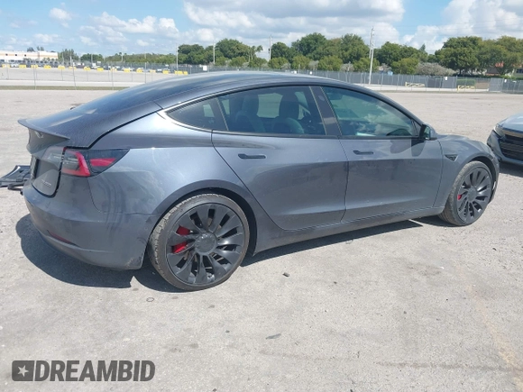 2022 Tesla Model 3 Performance with VIN 5YJ3E1EC9NF201184, listed as a IAAI auction lot 41534959 with 29,389 mi miles and . Bid and sale history available at DreamBid. Image 4.