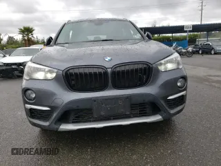 2018 BMW X1 xDrive28i with VIN WBXHT3C33J5K23187, listed as a Copart auction lot 71063192 with 97,403 mi miles. Bid and sale history available at carsss.com. Image 5.