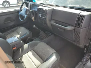 1999 Jeep Wrangler Sport z VIN 1J4FY19SXXP465037, wystawiony jako Copart lot #54772405 z przebiegiem 50 942 mil mil oraz Nie do naprawy • Non repairable. Historia ofert i sprzedaży dostępna na DreamBid. Obrazek 8.