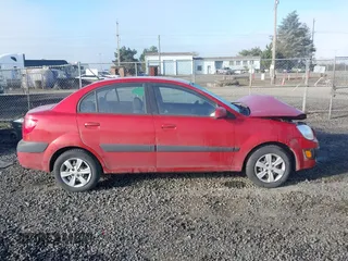 2009 Kia Rio LX with VIN KNADE223796485606, listed as a IAAI auction lot 41676881 with 58,852 mi miles and . Bid and sale history available at DreamBid. Image 13.