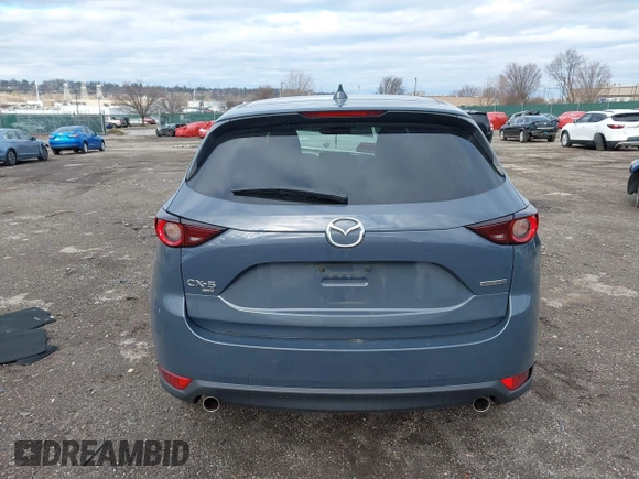 2021 Mazda CX-5 Touring with VIN JM3KFBCM5M0483547, listed as a IAAI auction lot 41683694 with 55,791 mi miles. Bid and sale history available at carsss.com. Image 16.