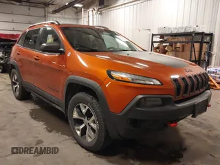 2015 Jeep Cherokee Trailhawk with VIN 1C4PJMBSXFW681680, listed as a IAAI auction lot 42277847 with 164,857 mi miles and . Bid and sale history available at DreamBid. Image 1.