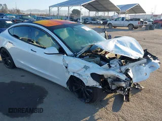 2018 Tesla Model 3 Long Range Battery with VIN 5YJ3E1EB0JF092440, listed as a IAAI auction lot 41881209 with 74,818 mi miles and . Bid and sale history available at DreamBid. Image 1.