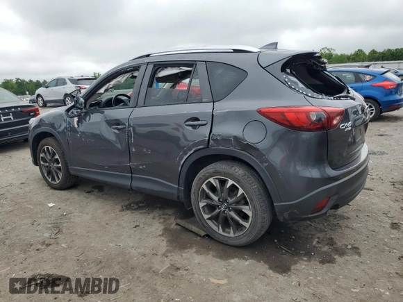2016 Mazda CX-5 Grand Touring z VIN JM3KE4DY5G0741800, wystawiony jako Copart lot #58565455 z przebiegiem 33 675 mil mil oraz Szkoda całkowita • Salvage title. Historia ofert i sprzedaży dostępna na DreamBid. Obrazek 2.