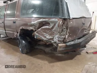 1994 GMC Suburban with VIN 1GKEC16K1RJ738915, listed as a IAAI auction lot 41717424 with 173,338 mi miles. Bid and sale history available at carsss.com. Image 6.