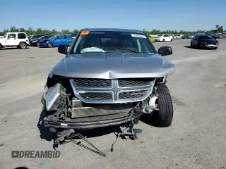 2015 Dodge Journey American Value with VIN 3C4PDCABXFT712192, listed as a Copart auction lot 55680975 with 104,579 mi miles and Salvage Title. Bid and sale history available at DreamBid. Image 14.