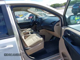 2014 Dodge Grand Caravan SXT with VIN 2C4RDGCGXER322705, listed as a IAAI auction lot 42170301 with 147,070 mi miles and . Bid and sale history available at DreamBid. Image 5.