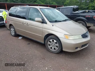 2002 Honda Odyssey EX z VIN 2HKRL18672H549312, wystawiony jako IAAI lot #42521232 z przebiegiem 233 982 mil mil oraz . Historia ofert i sprzedaży dostępna na DreamBid. Obrazek 1.