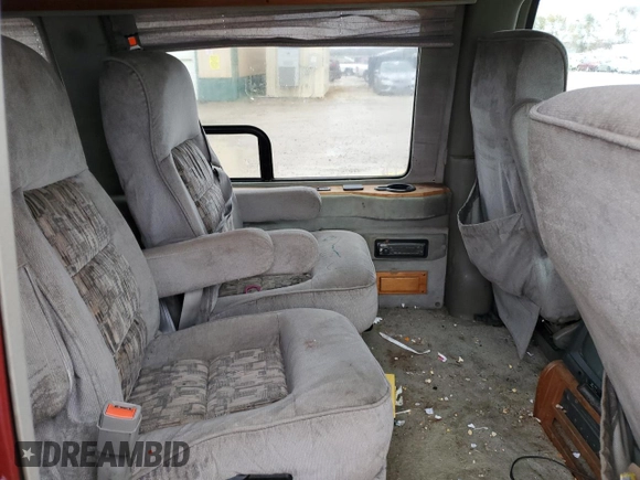 1999 GMC Savana z VIN 1GDFG15R3X1157847, wystawiony jako Copart lot #79041264 z przebiegiem 208 719 mil mil oraz Szkoda całkowita • Salvage title. Historia ofert i sprzedaży dostępna na DreamBid. Obrazek 11.