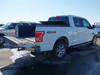 2015 Ford F-150 XLT with VIN 1FTEW1EP0FKE42273, listed as a IAAI auction lot 41988265 with 119,483 mi miles. Bid and sale history available at carsss.com. Image 4.
