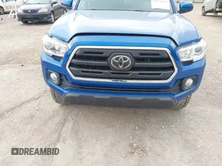 2018 Toyota Tacoma SR5 with VIN 3TMAZ5CNXJM069212, listed as a IAAI auction lot 42010564 with 73,825 mi miles and . Bid and sale history available at DreamBid. Image 6.