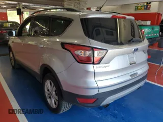 2018 Ford Escape SE z VIN 1FMCU9GD3JUC13075, wystawiony jako IAAI lot #42537659 z przebiegiem 77 270 mil mil oraz . Historia ofert i sprzedaży dostępna na DreamBid. Obrazek 16.