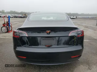 2023 Tesla Model 3 with VIN 5YJ3E1EA9PF687187, listed as a Copart auction lot 61044055 with 7,007 mi miles and Salvage title. Bid and sale history available at DreamBid. Image 6.