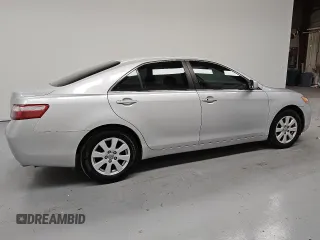 2009 Toyota Camry LE z VIN 4T1BK46K89U595880, wystawiony jako Copart lot #55069935 z przebiegiem 265 831 mil mil oraz Czysty tytuł • Clean title. Historia ofert i sprzedaży dostępna na DreamBid. Obrazek 3.