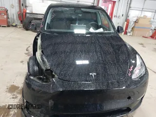 2023 Tesla Model Y Long Range with VIN 7SAYGDEE2PF808844, listed as a IAAI auction lot 41941905 with 39,951 mi miles and . Bid and sale history available at carsss.com. Image 13.