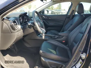 2014 Mazda 3 S Touring with VIN JM1BM1L31E1162990, listed as a Copart auction lot 51667034 with 92,255 mi miles and Salvage Title. Bid and sale history available at DreamBid. Image 7.