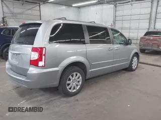 2013 Chrysler Town & Country Touring with VIN 2C4RC1BG9DR714736, listed as a IAAI auction lot 41824364 with 156,486 mi miles. Bid and sale history available at carsss.com. Image 4.