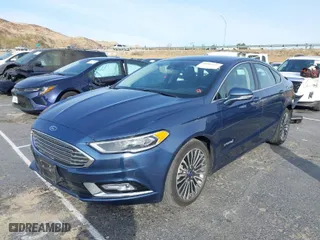 2018 Ford Fusion Hybrid Titanium with VIN 3FA6P0RU9JR120589, listed as a IAAI auction lot 41463194 with 74,025 mi miles. Bid and sale history available at carsss.com. Image 2.