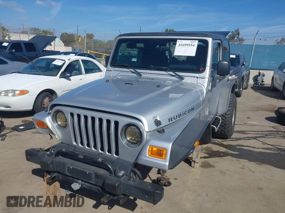 2004 Jeep Wrangler Rubicon with VIN 1J4FA69S94P701660, listed as a IAAI auction lot 41699554 with 74,640 mi miles. Bid and sale history available at carsss.com. Image 2.