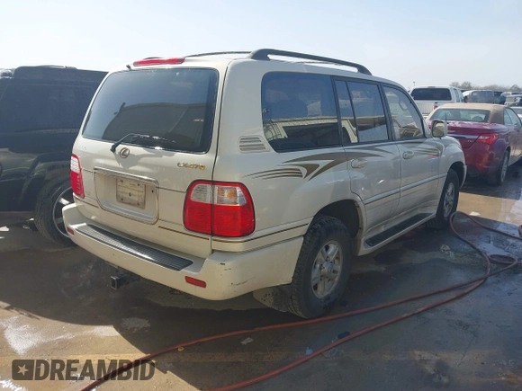 2000 Lexus LX 470 with VIN JT6HT00W5Y0080249, listed as a IAAI auction lot 41726247 with 315,707 mi miles and . Bid and sale history available at carsss.com. Image 4.