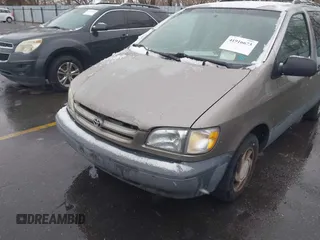 1999 Toyota Sienna LE with VIN 4T3ZF13C9XU164032, listed as a IAAI auction lot 41916673 with 296,628 mi miles and . Bid and sale history available at DreamBid. Image 6.
