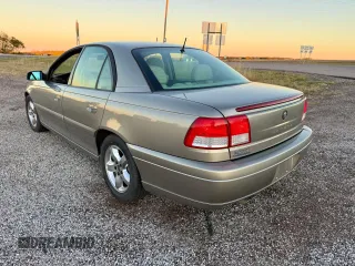 2001 Cadillac Catera z VIN W06VR54R01R009345, wystawiony jako Copart lot #80393534 z przebiegiem 43 757 mil mil oraz Tytuł czysty. Historia ofert i sprzedaży dostępna na DreamBid. Obrazek 3.