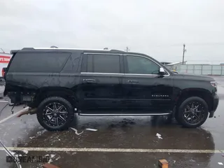 2017 Chevrolet Suburban Premier with VIN 1GNSKJKC4HR162261, listed as a IAAI auction lot 41593672 with 100,136 mi miles. Bid and sale history available at carsss.com. Image 14.