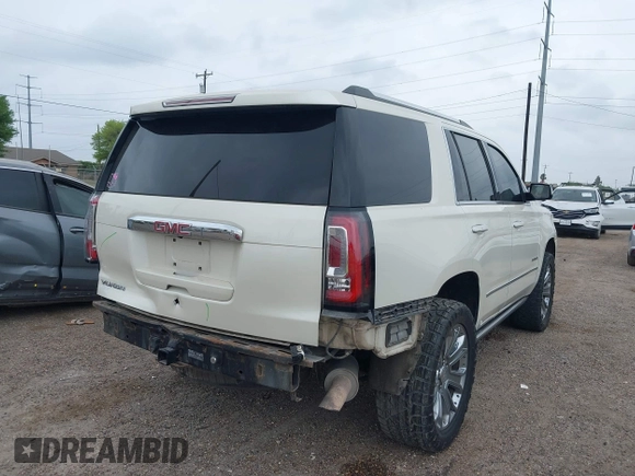 2015 GMC Yukon Denali z VIN 1GKS1CKJ3FR713531, wystawiony jako IAAI lot #41866691 z przebiegiem 157 666 mil mil oraz . Historia ofert i sprzedaży dostępna na DreamBid. Obrazek 6.