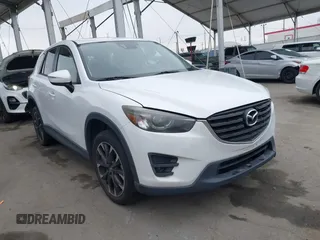 2016 Mazda CX-5 Grand Touring with VIN JM3KE4DY7G0737232, listed as a IAAI auction lot 42158279 with Not Provided miles and . Bid and sale history available at DreamBid. Image 1.